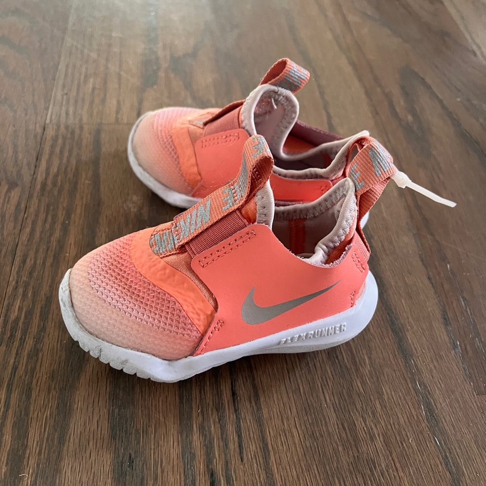 Nike Kids Coral-Orange Slip-On Sneakers with Silver Swoosh